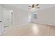 This bedroom features light walls and floors and a ceiling fan with attached lights at 302 Davis Rd, Stockbridge, GA 30281
