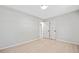 This bright bedroom features light walls and floors and two closets at 302 Davis Rd, Stockbridge, GA 30281