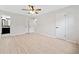 Bedroom featuring hardwood floors, ceiling fan, closet, and ensuite bathroom at 302 Davis Rd, Stockbridge, GA 30281