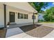 Charming home with a covered porch, updated landscaping and fresh exterior paint creates a welcoming entrance at 302 Davis Rd, Stockbridge, GA 30281