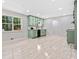 Updated kitchen flows from the living room and boasts painted cabinets, modern appliances, and ample counter space at 302 Davis Rd, Stockbridge, GA 30281