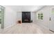 Bright living room with luxury vinyl floors and electric fireplace, perfect for relaxing and entertaining at 302 Davis Rd, Stockbridge, GA 30281