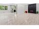 Spacious living room features luxury vinyl floors, an electric fireplace and adjoins the updated kitchen at 302 Davis Rd, Stockbridge, GA 30281