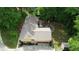 Aerial view showcases the home, the back patio with a fire pit, and the two-car garage at 3311 Creek Hollow Dr, Marietta, GA 30062