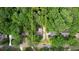 An aerial shot of a home surrounded by trees, with a yellow boundary line showing the property's perimeter at 3311 Creek Hollow Dr, Marietta, GA 30062
