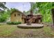 The home features a two-story wooden deck and a stone patio for outdoor enjoyment at 3311 Creek Hollow Dr, Marietta, GA 30062