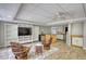 Open basement living area with a kitchenette, TV, bookshelves, and casual seating at 3311 Creek Hollow Dr, Marietta, GA 30062
