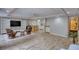 Large finished basement boasts wood-look floors, kitchenette, and cozy seating area at 3311 Creek Hollow Dr, Marietta, GA 30062