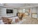 Basement living area with a TV, bookshelves, kitchenette, and comfortable seating at 3311 Creek Hollow Dr, Marietta, GA 30062