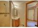Updated bathroom featuring a tiled shower, vanity with sink, and adjacent bedroom at 3311 Creek Hollow Dr, Marietta, GA 30062
