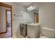This bathroom has a convenient washer and dryer in addition to a shower over the tub at 3311 Creek Hollow Dr, Marietta, GA 30062