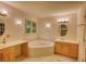 Bathroom featuring a corner jetted tub, vanity with double sinks, and recessed lighting at 3311 Creek Hollow Dr, Marietta, GA 30062