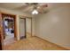 Bedroom featuring unfinished floors, ceiling fan, and closet at 3311 Creek Hollow Dr, Marietta, GA 30062
