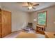 Bright bedroom featuring a cozy chair and window view for relaxing or reading at 3311 Creek Hollow Dr, Marietta, GA 30062