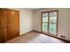 Empty bedroom with a large window and closet at 3311 Creek Hollow Dr, Marietta, GA 30062