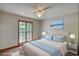 Staged bedroom with a soft color palette and a view to the outdoors at 3311 Creek Hollow Dr, Marietta, GA 30062