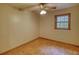 Bright bedroom with neutral walls, ceiling fan, and window letting in natural light at 3311 Creek Hollow Dr, Marietta, GA 30062