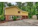 Two-story home with brick accents, a two-car garage, and a long driveway at 3311 Creek Hollow Dr, Marietta, GA 30062
