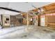 Spacious garage featuring unfinished walls and ceiling with concrete floor at 3311 Creek Hollow Dr, Marietta, GA 30062