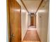 Interior hallway with neutral walls, and wood trim, featuring a warm carpet runner at 3311 Creek Hollow Dr, Marietta, GA 30062