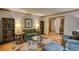 Inviting living room with hardwood floors, bookshelves, and comfortable furnishings at 3311 Creek Hollow Dr, Marietta, GA 30062