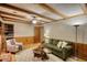 Spacious living room featuring hardwood floors, exposed beams, and comfortable furnishings at 3311 Creek Hollow Dr, Marietta, GA 30062