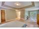 Open and airy main bedroom boasting access to a private balcony and an en-suite bathroom at 3311 Creek Hollow Dr, Marietta, GA 30062