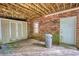 Covered patio with a brick wall, storage shed, and wooden deck flooring at 3311 Creek Hollow Dr, Marietta, GA 30062