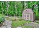 Outdoor shed with double doors and an oval vent offers storage space at 3311 Creek Hollow Dr, Marietta, GA 30062