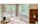 Inviting sunroom featuring a private balcony with serene nature views, perfect for relaxing or entertaining guests at 3311 Creek Hollow Dr, Marietta, GA 30062