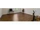 An ample basement space features wood floors and natural light at 436 Barnett St, Woodstock, GA 30188