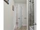 Neutral bathroom showing the view of the shower and the door leading to another room at 436 Barnett St, Woodstock, GA 30188