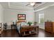 Cozy bedroom with dark hardwood floors, tray ceilings, and a large window that provides natural light at 436 Barnett St, Woodstock, GA 30188