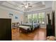 Spacious bedroom with tray ceiling, lots of natural light and hardwood flooring at 436 Barnett St, Woodstock, GA 30188