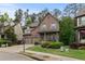 Charming brick home with an attached two-car garage and a meticulously maintained front yard and landscaping at 436 Barnett St, Woodstock, GA 30188
