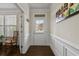 Welcoming foyer featuring pristine millwork, hardwood floors, and a charming entryway to this delightful home at 436 Barnett St, Woodstock, GA 30188