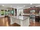 Gourmet kitchen features granite countertops, an island, and stainless steel appliances at 436 Barnett St, Woodstock, GA 30188