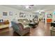 Open-concept living room with hardwood floors and recessed lighting at 436 Barnett St, Woodstock, GA 30188