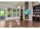 Spacious living room with soaring ceilings, fireplace, hardwood floors and views of the backyard through plentiful windows at 436 Barnett St, Woodstock, GA 30188
