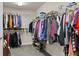 Large walk-in closet with lots of metal shelving and hanging space for storing clothing and shoes at 436 Barnett St, Woodstock, GA 30188