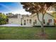 Backyard with a concrete patio, green lawn, and a light green house at 47 Cliff Ct, Villa Rica, GA 30180