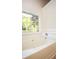 Bathroom featuring a large bathtub, a window, and neutral wall coloring at 47 Cliff Ct, Villa Rica, GA 30180