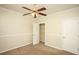 Bedroom features a closet, ceiling fan, carpet and natural lighting at 47 Cliff Ct, Villa Rica, GA 30180