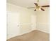 Cozy bedroom featuring neutral walls, carpet flooring, ceiling fan, and paneled doors at 47 Cliff Ct, Villa Rica, GA 30180