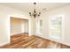 Dining room with hardwood floors, a chandelier, and large windows that provide ample light at 47 Cliff Ct, Villa Rica, GA 30180