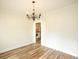 Dining area featuring hardwood floors, a chandelier, and cream-colored walls at 47 Cliff Ct, Villa Rica, GA 30180