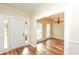 Front entry with hardwood floors offers a view into the dining room with natural light at 47 Cliff Ct, Villa Rica, GA 30180