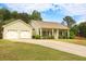 Charming single-story home with a two-car garage and a well-maintained front yard at 47 Cliff Ct, Villa Rica, GA 30180