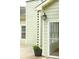 Exterior shot showing custom rain chain and access to screened porch at 47 Cliff Ct, Villa Rica, GA 30180