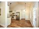 Modern kitchen with stainless steel appliances, white cabinets, and vaulted ceilings above LVP flooring at 47 Cliff Ct, Villa Rica, GA 30180